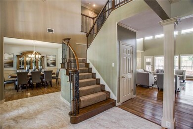Another view of the staircase and showing formal d