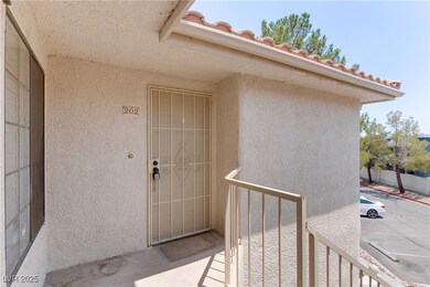 Entrance to property with stucco siding and a tile