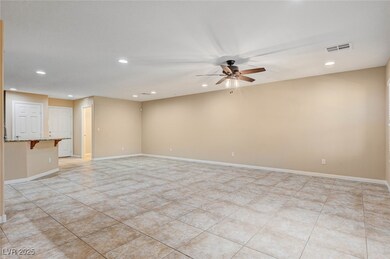 Unfurnished living room featuring a ceiling fan, r