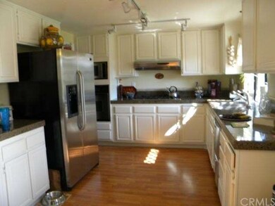 Kitchen w/ granite counter tops + stainless steel 