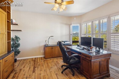 Office Located off the Entry with Custom Cabinets and Access to the Front Porch!