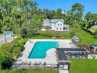 View of pool with a pergola, a patio, and a lawn