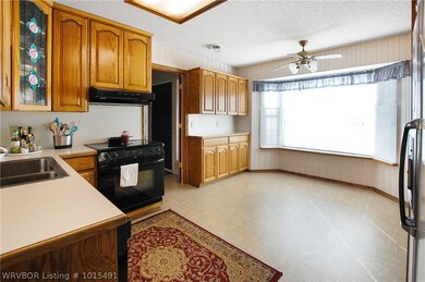 Eat in kitchen with large window looking out the f