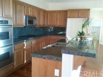 Kitchen with stainless steel appliances and granit
