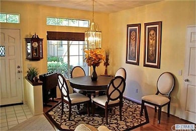Gracious dining room with a large, lovely window.