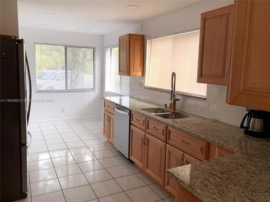 UPGRADED KITCHEN CABINETS WITH GRANITE COUNTERTOPS.