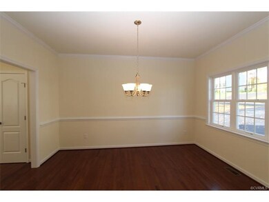 Dining Room features hardwood floors, chandelier, 