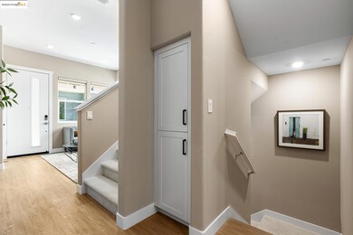 Staircase featuring wood finished floors and recessed lighting