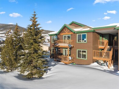 View of front of home with a mountain view and a b