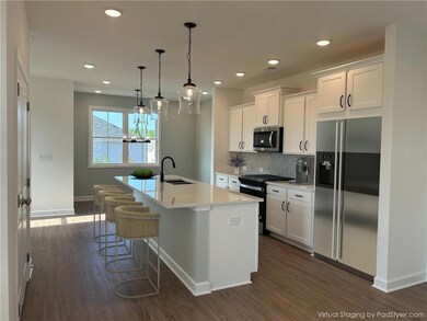 The kitchen is the anchor of this open living plan
