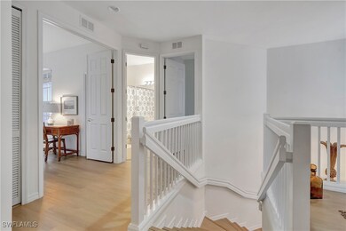 Staircase with hardwood / wood-style flooring