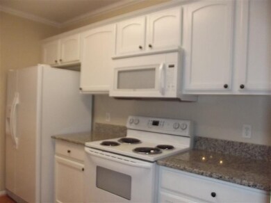 Kitchen has lovely granite counters