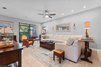 Living room with ceiling fan, recessed lighting, visible vents, and light tile patterned floors