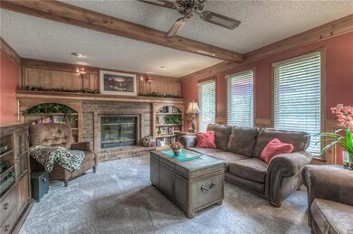 The family room with a beautiful brick fireplace, 