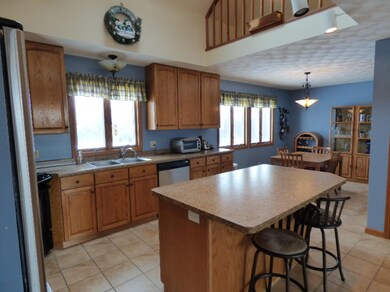 Open kitchen, dining, and living areas