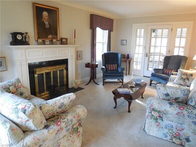Elegant formal living room with gas fireplace.  Do