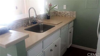 Upgraded kitchen counters with backsplash and stai