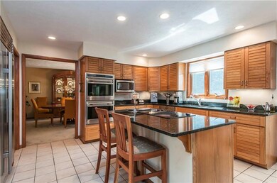 Custom oak cabinetry, high-end appliances includin