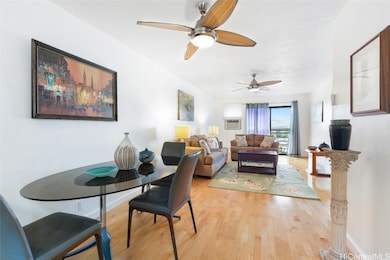 This dining area is spacious and has hardwood floo