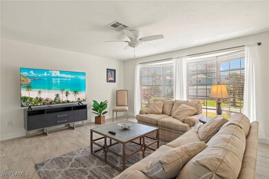 Living area featuring ceiling fan and baseboards