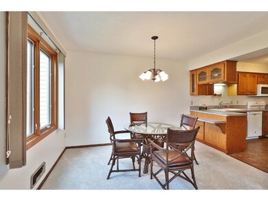 The light and bright dining area includes a new fi