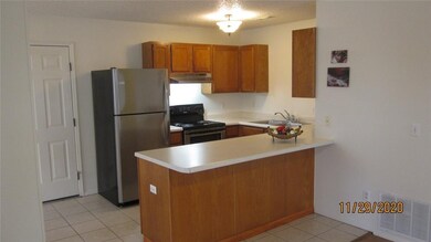 kitchen open to living and dining.