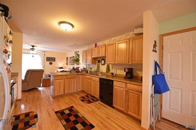 Spacious kitchen with wood flooring