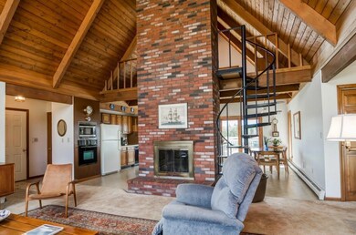 Living room, spiral staircase to loft