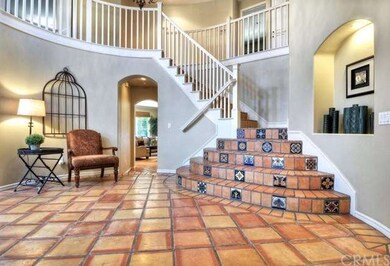 Large formal foyer with cathedral ceilings.