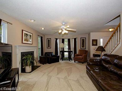 Living Room. Beautiful bay window in the family room and check out that brand new carpet!