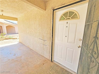 Doorway to property with stucco siding