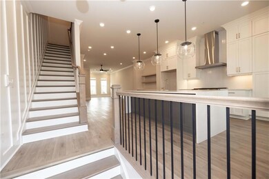 Entering onto the main level, light overwhelms the