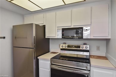 Kitchen featuring appliances with stainless steel 