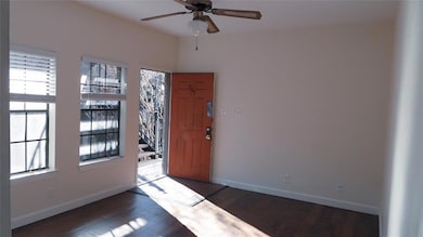 Entryway featuring dark wood finished floors and ceiling fan