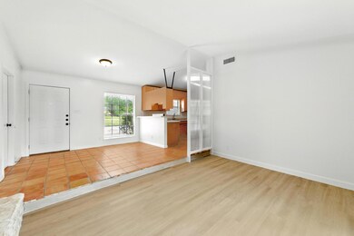 Unfurnished living room with light wood-style flo