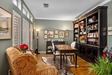 The spacious home office is just off of the entry