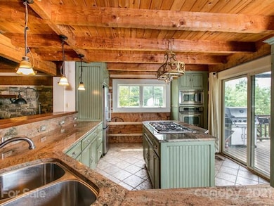 Granite counters, 5 burner gas stove, wall ovens i