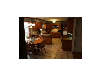 Spacious Kitchen With Tile Flooring, Built-In Desk