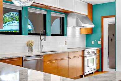 Kitchen has been updated with quartz countertops and induction oven.