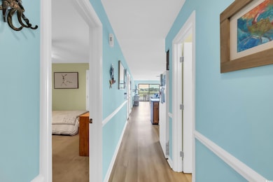 Hallway with light wood-type flooring
