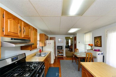 Kitchen with gas stove & wide plank floors