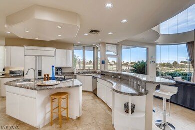 Kitchen boasts custom cabinetry, stainless steel a