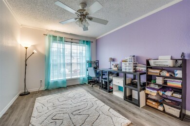 2nd bedroom with crown molding, ceiling fan, a tex