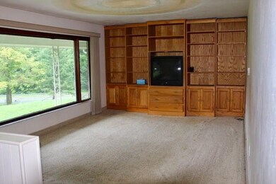 Living Room with wall of storage and spacious pict