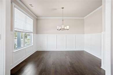 Unfurnished room with crown molding, a notable cha