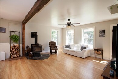 The wood stove fills the first floor...