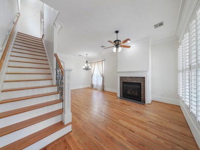 Upon entering this charming home, you will find a formal living room with fireplace, and formal dining