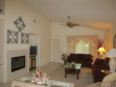 Living room with tile flooring, fireplace and door