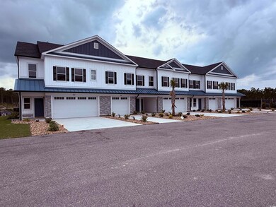 View of property featuring a standing seam roof, a