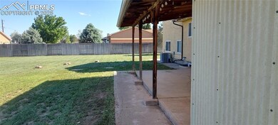 View of yard with central AC unit and a patio area